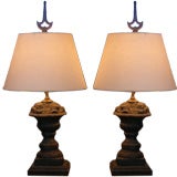 Pair of iron lamps with spire finials