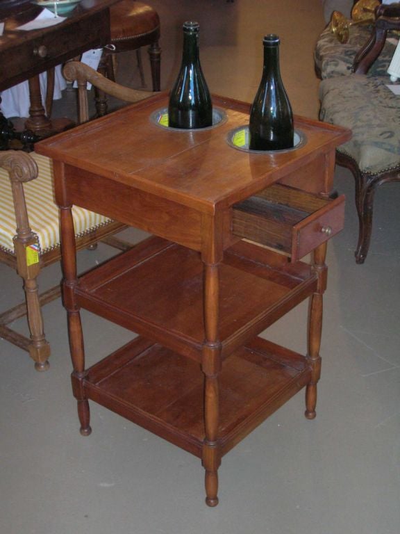 Three tiered Refraichissoir table with zinc inserts and turned legs. Chill your wine and serve your hors d'oevres. Nice original patina.