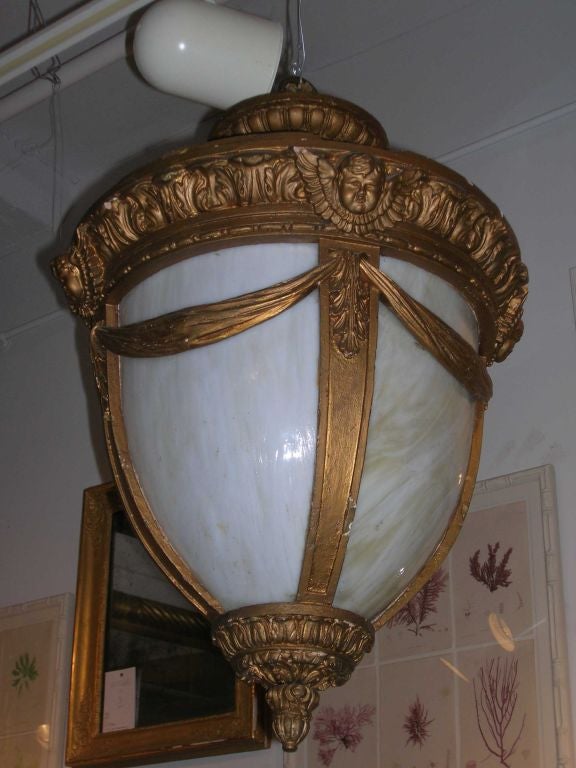 Giltwood lantern with angels, swags and egg and dart detail with original milk glass panels.