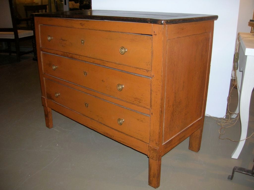 Three-drawer ochre painted chest with black painted top. Original hardware and nice patina!