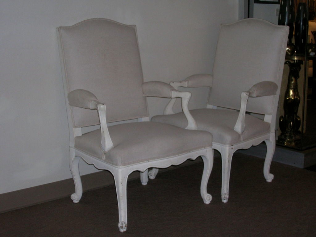 Pair of high back antique white painted Louis XV style bergere armchairs. Newly covered in grey linen.