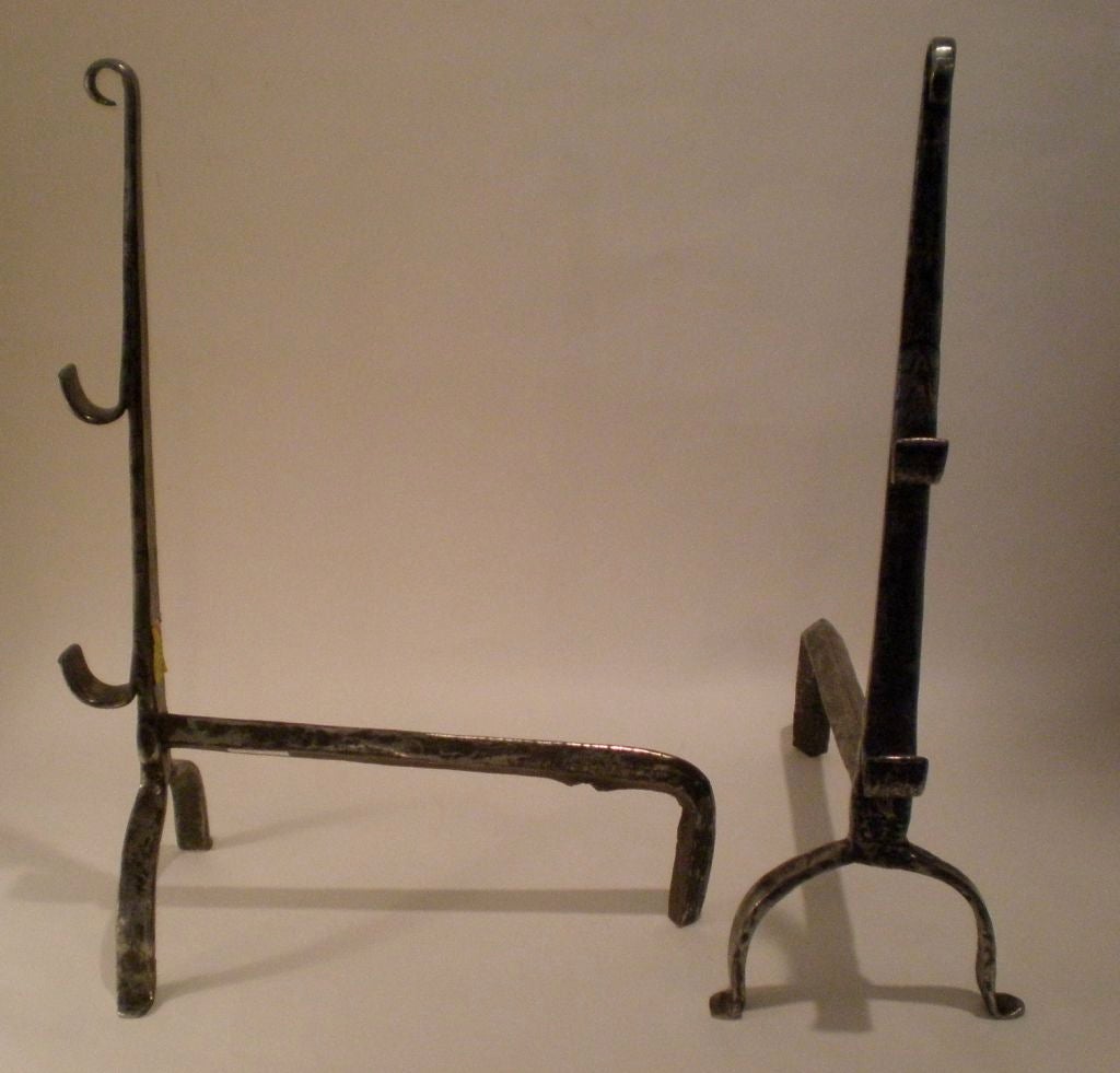 Pair of tall andirons with incised decoration