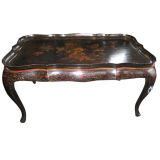 CHINESE BLACK LACQUERED AND POLYCHROME DECORATED COFFEE TABLE