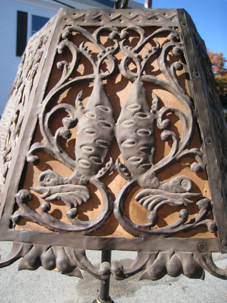 Italian Renaissance style wrought iron and tin floor lamp, shade with decorative fish motifs