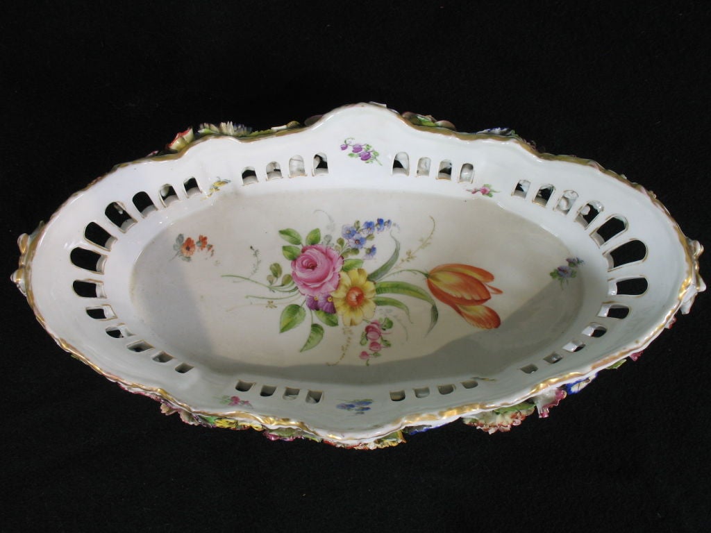 Lovely German hand-painted reticulated jardiniere in the neoclassical style with molded flowers, detailed interior painting.<br />
<br />
Marks shown, Von Schierholz porcelain