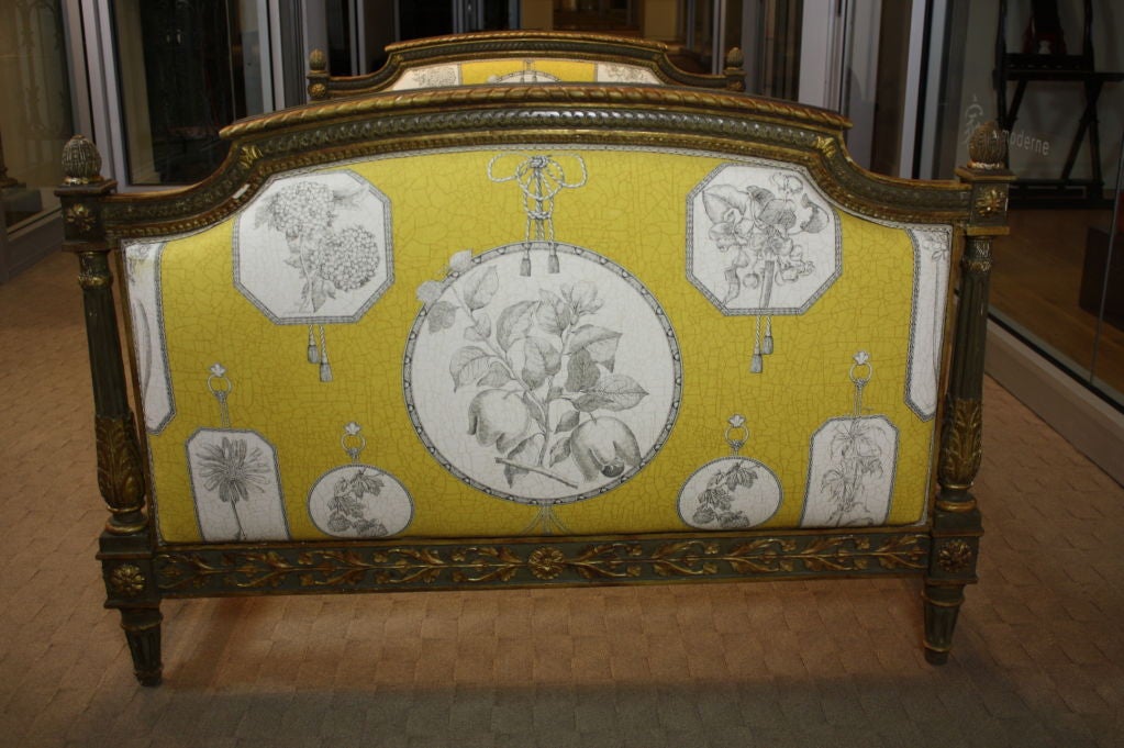 French painted daybed, nicely carved, in the neoclassical style (Louis XVI period) with some traces of gilding.  Side rails are beautifully carved. Newly-upholstered in Pierre-Frey fabric, and includes three cushions and custom coverlet sized for a