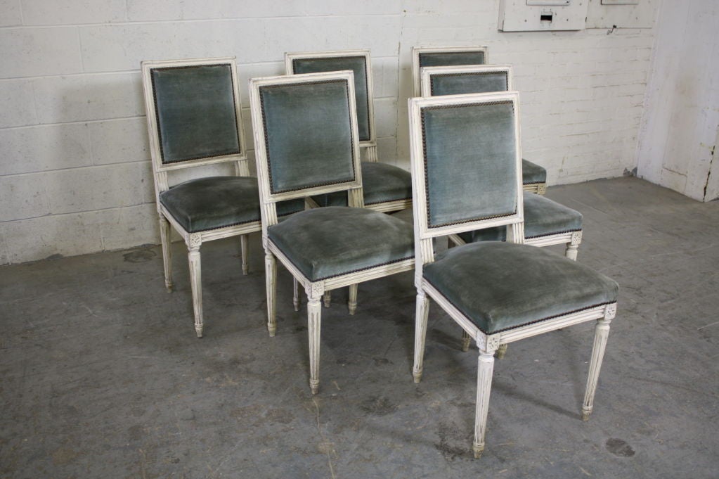 Set of six French painted dining chairs in the Louis XVI style, with vintage silk velvet upholstery.