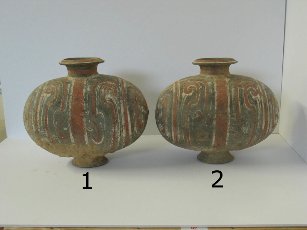 Han polychrome funerary pots, cocoon or duck egg shape.<br />
Sold as pair or individually ($2400 ea).