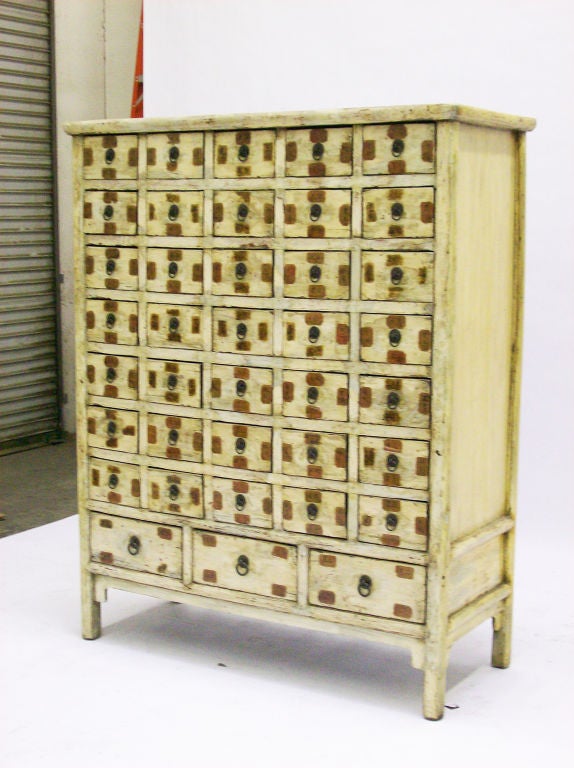 Light Lacquered Apothecary Chest with 38 drawers from Shanxi, China c. 1850.  Elm construction with layers of red and cream/white lacquer.