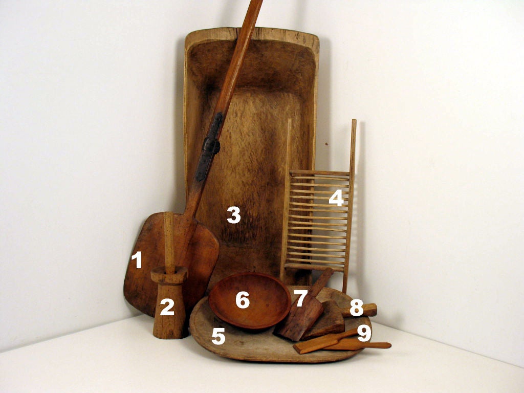 Mixed lot of wood utensils and implements.<br />
Sold individually or as a set.<br />
1: English Bread Paddle: 76