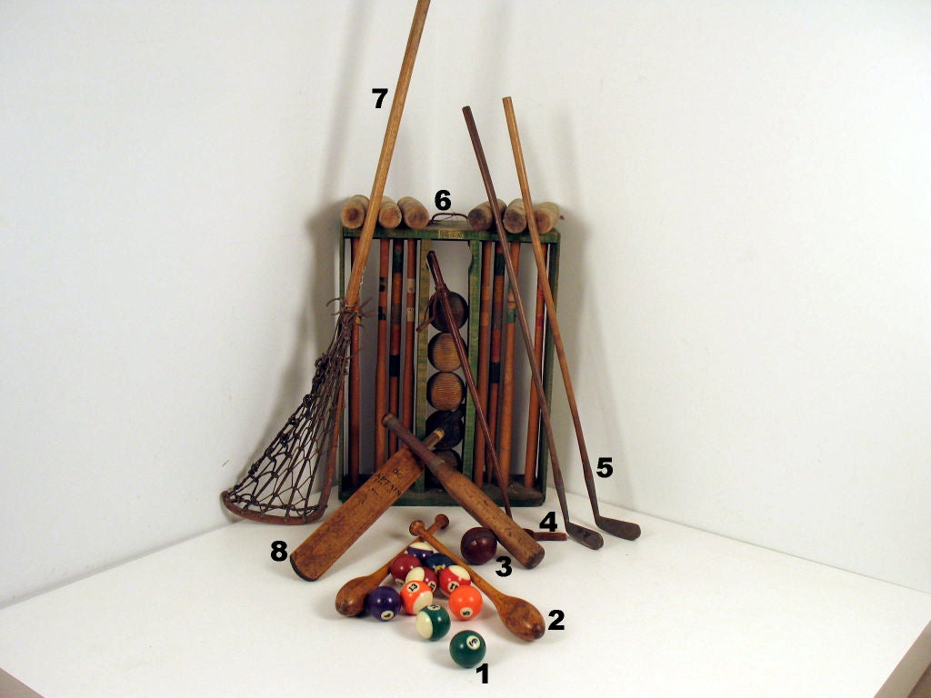 Assorted Sporting Goods sold separately or as a group:<br />
1: SOLD<br />
2: Pair of Chubs $75<br />
3: Quaife & Lilley bat (Birmingham, England) $75<br />
4: Riding whip $50<br />
5: Pair of 
