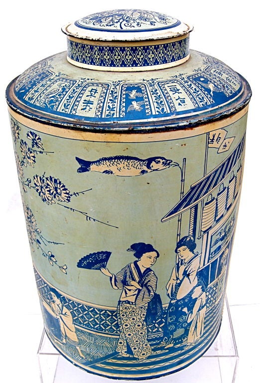 Unusual and beautiful monochromatic blue tea canister.   Various subtle shades of blue highlight the circular exterior scenes of merriment.  Great interior accent for any contemporary or traditional decor.
