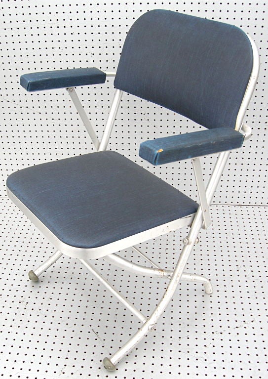 Sophisticated and stylish tubular aluminum folding chairs designed by Warren McCarthur.  Original fabric in various sates of condition.  Lend themselves nicely to reupholstering in contemporary fabrics.  Many are available.  Were acquired from a