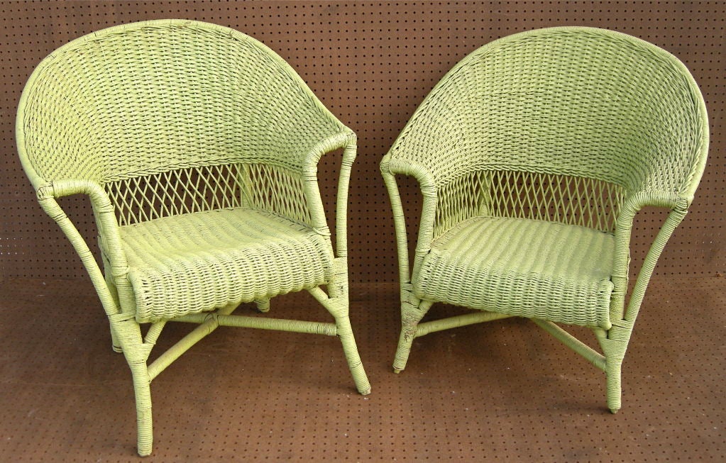 Great pair of colorful vintage wicker occasional chairs.  Original cushions reupholstered in a graphic updated upholstery.  A 