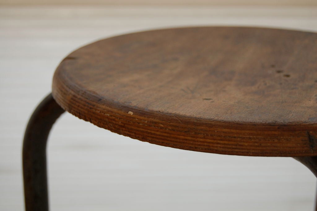 Jean Prouve early laminated stool , metal frame and rubber feet pads , documented piece .