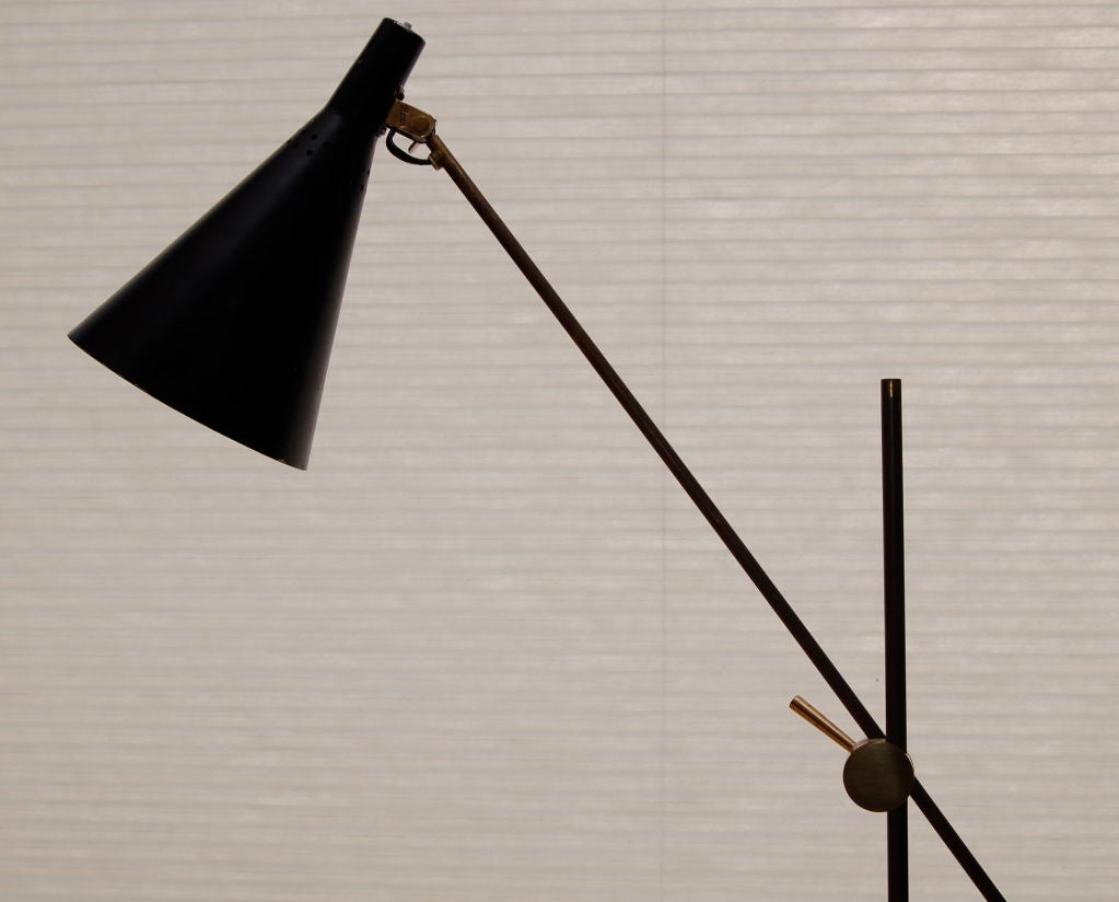 Very rare Tapio Wirkkala floor lamp , model no. K10-11 constructed of brass and painted metal , manufactured by Idman and stamped to the upper shade connector and to the stem handle as shown . The main arm can be moved up and down the central