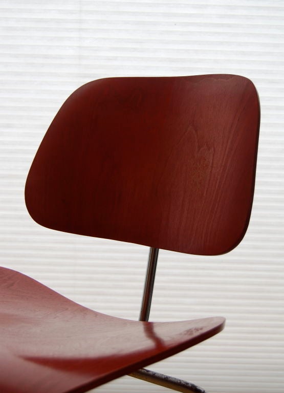 CHARLES AND RAY EAMES ; PAIR OF RED DCM'S