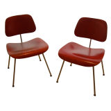 CHARLES AND RAY EAMES ; PAIR OF RED DCM'S