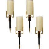 Set of four stitched leather wallights by Jacques Adnet