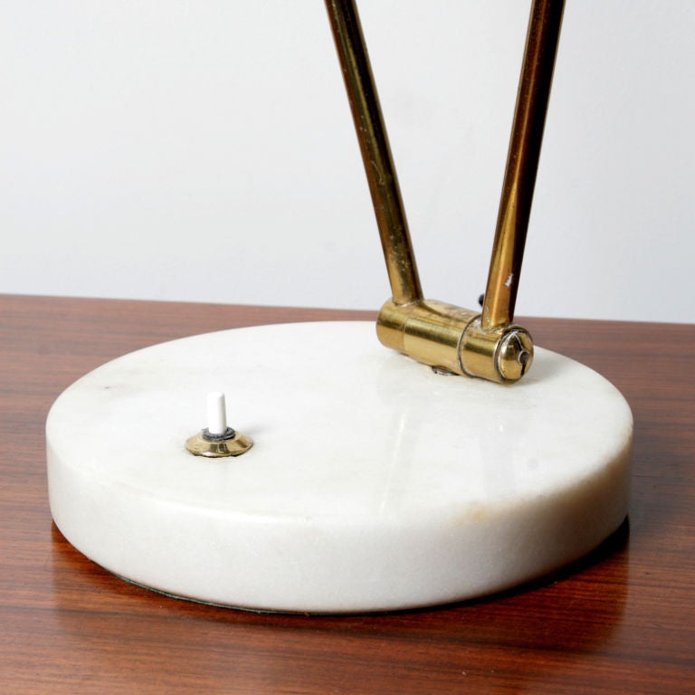 Articulated black painted table lamp with brass stem and thick carrera marble base. Designed by Angelo Lelli for Arredoluce, Monza. Literature: page 202 Illuminazione d' Oggi by Roberto Aloi.