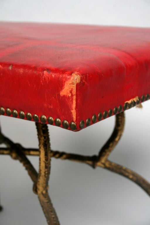 Pair of renaissance revival red leather stools