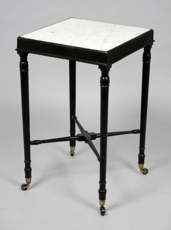Mid 19th century ebonised mahogany side table with marble top.