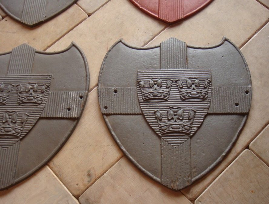 Set of 10 large cast iron armorial shields