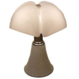 The Pipistrello table lamp by Gae Aulenti design