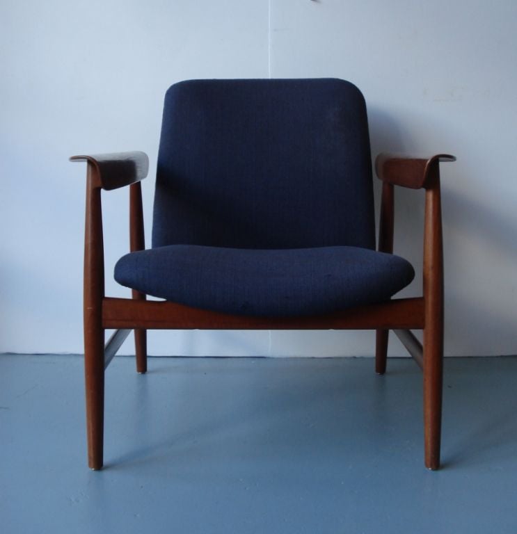 An Upholstered Teak Open Armchair with Incised Makers Stamp to Inside Front Rail. Designed by Finn Juhl.