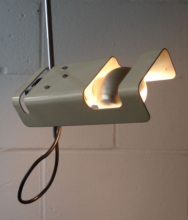Spider (Clamp Lamp) with Horizontal Reflector of White Enamelled Metal and Clamp Mounted Black Plastic Arm for Adjustment. <br />
The Lamp Fitted with the Original Partially Mirrored Cornalux Bulb. <br />
Designed by Joe Columbo 1965; this example