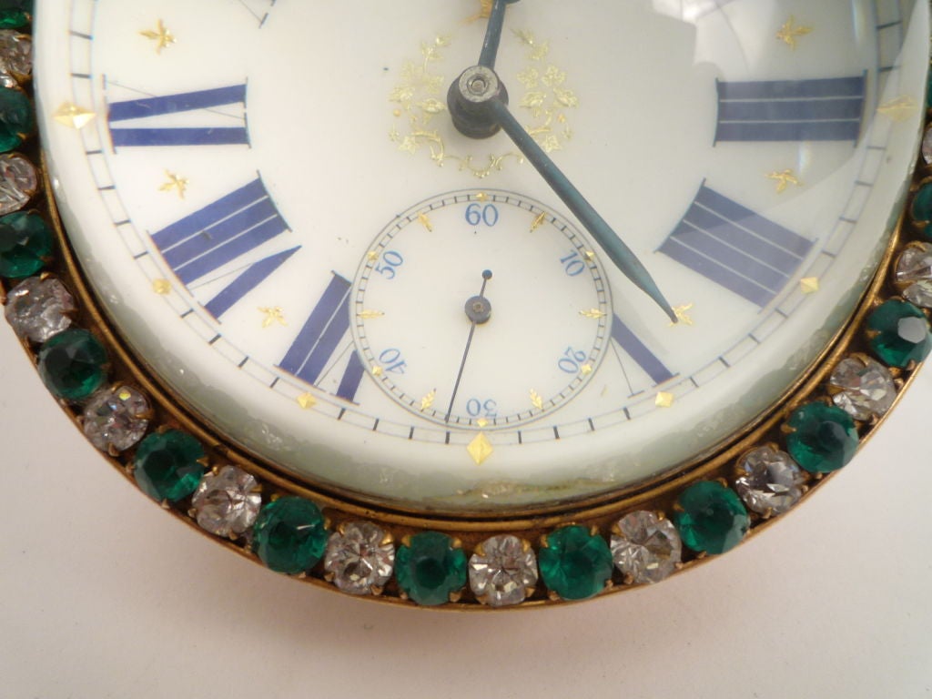 Large glass ball clock with green and clear paste surround, early 20th C, swiss movement