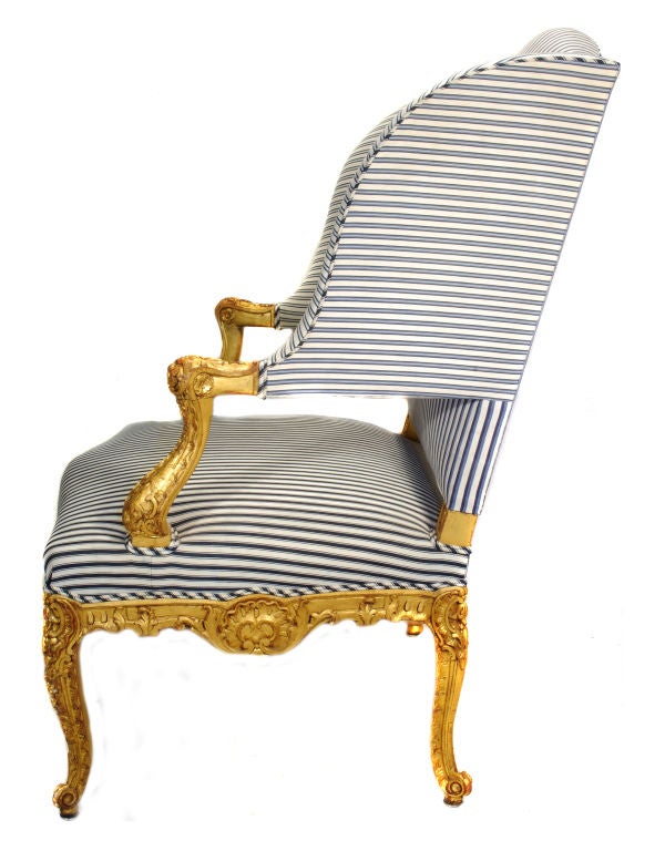 French Pair highly carved Louis XV/Régence style wingback armchairs.