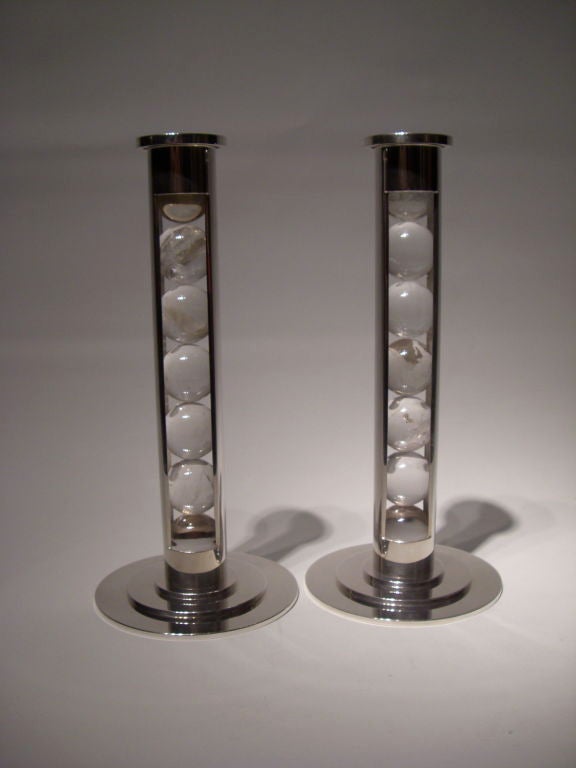A pair of rock crystal sphere and sterling silver candlesticks<br />
Designed by Paul Belvoir