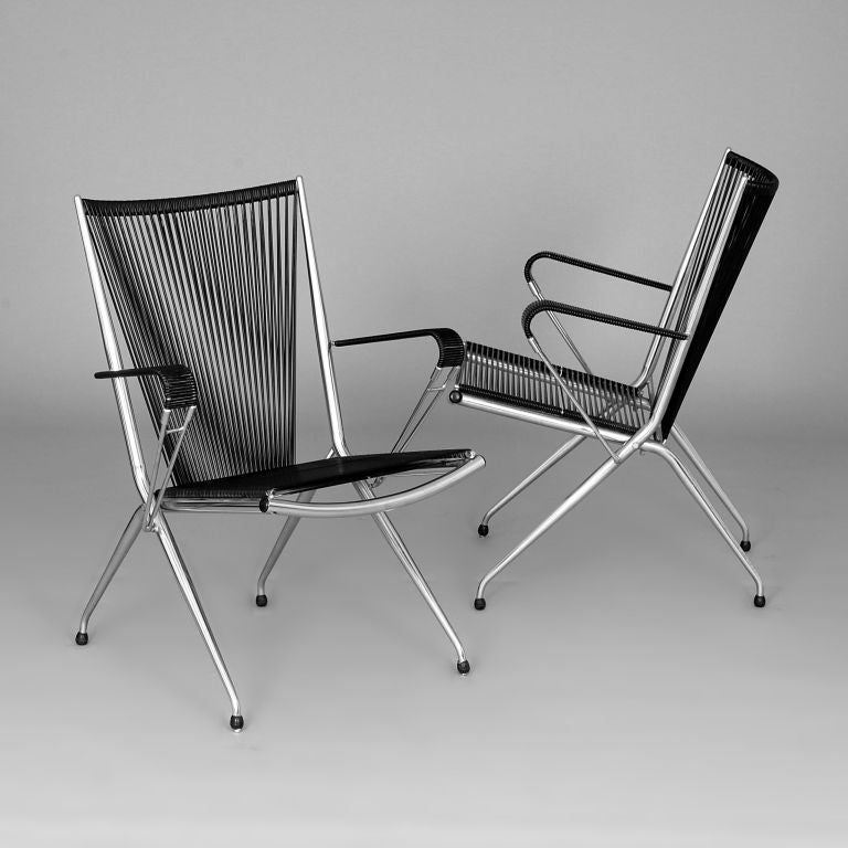 Pair of folding Armchairs in Chrome and black plastic by Andre Monpoix for `Meubles TV`, France 1950`s.