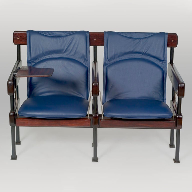 Auditorium Chairs designed by Sergio Rodrigues (b1927), Brazil, 1965

Note: We have another example of this model so please enquire. 

These chairs, from the IAB Concert Hall in Rio Janeiro, have a swing mechanism that allowed the audience to