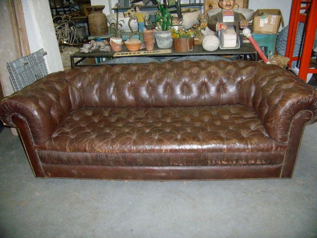 Vintage Leather Chesterfield Sofa retains its original brass casters.