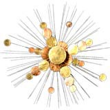 A Sunburst Metal Wall Sculpture in the manner of Curtis Jere USA