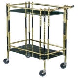 A 1960
s Bronze
Glass Shelved Trolley A 1960
s Bronze
Glass Shelved Trolley