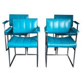 A Set of Four Turquoise Vinyl Upholstered Chairs
