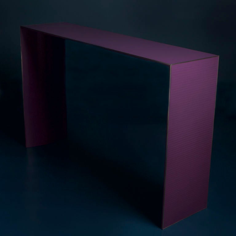 A Purple Skinny Lacquered Console Table by Talisman.
One of nine designs from the new Talisman Lacquer Collection. The natural lacquer process takes two weeks per piece and the lacquer is cured over time to create the ribboned effect. Each design