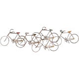 A Metal Wall Sculpture by Curtis Jere of Scene of Five Bicycles