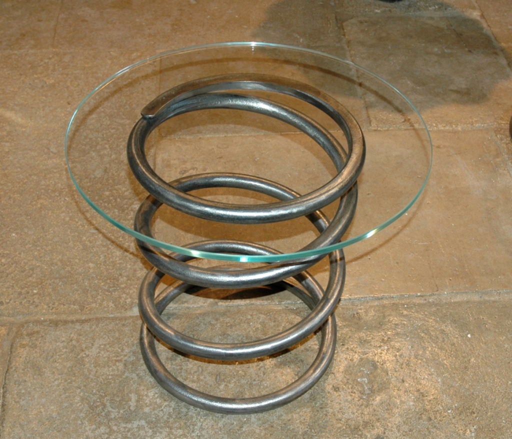 Sherman Tank Springs with glass tops
American, World War II era Sherman tank springs. Excellent end tables or coffee tables. Spring measures 20" high by 16" diameter with a 23.5" glass top.
Two available. Priced individually