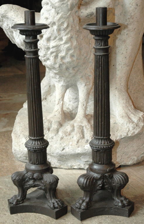 Italian, late 19th century pair of cast iron candle sticks.