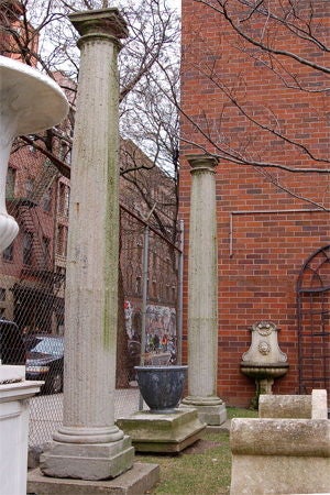 LIMESTONE COLUMNS / GS19<br />
Pair of French 19th century limestone columns with fluted, tapered shafts and Doric capitals. Sold as a pair. (Height: 10’ Maximum diameter: 16” Base: 22 x 22”)