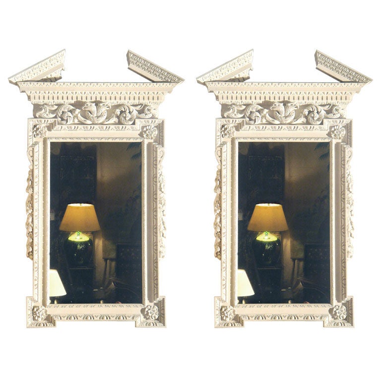 A Pair Of Carved Wood Mirrors For Sale