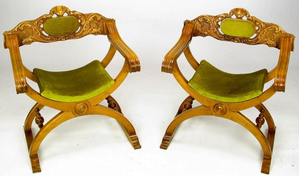 The folding curule chair dates back to the time of Julius Caesar.  It first appeared with an X-form frame, and sans back rest. In 15th century Spain and Italy it was redesigned with a sled base and back rest. This pair of curule campaign chairs with