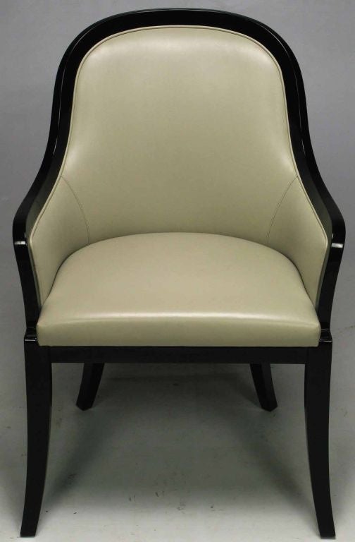 Elegant arm chair in black lacquered wood and dove gray leather. Numerous applications, from the office to the bedroom, to the living room or foyer, this is a sturdy well built arm chair.  <br />
<br />
Although unmarked, the chair is from an