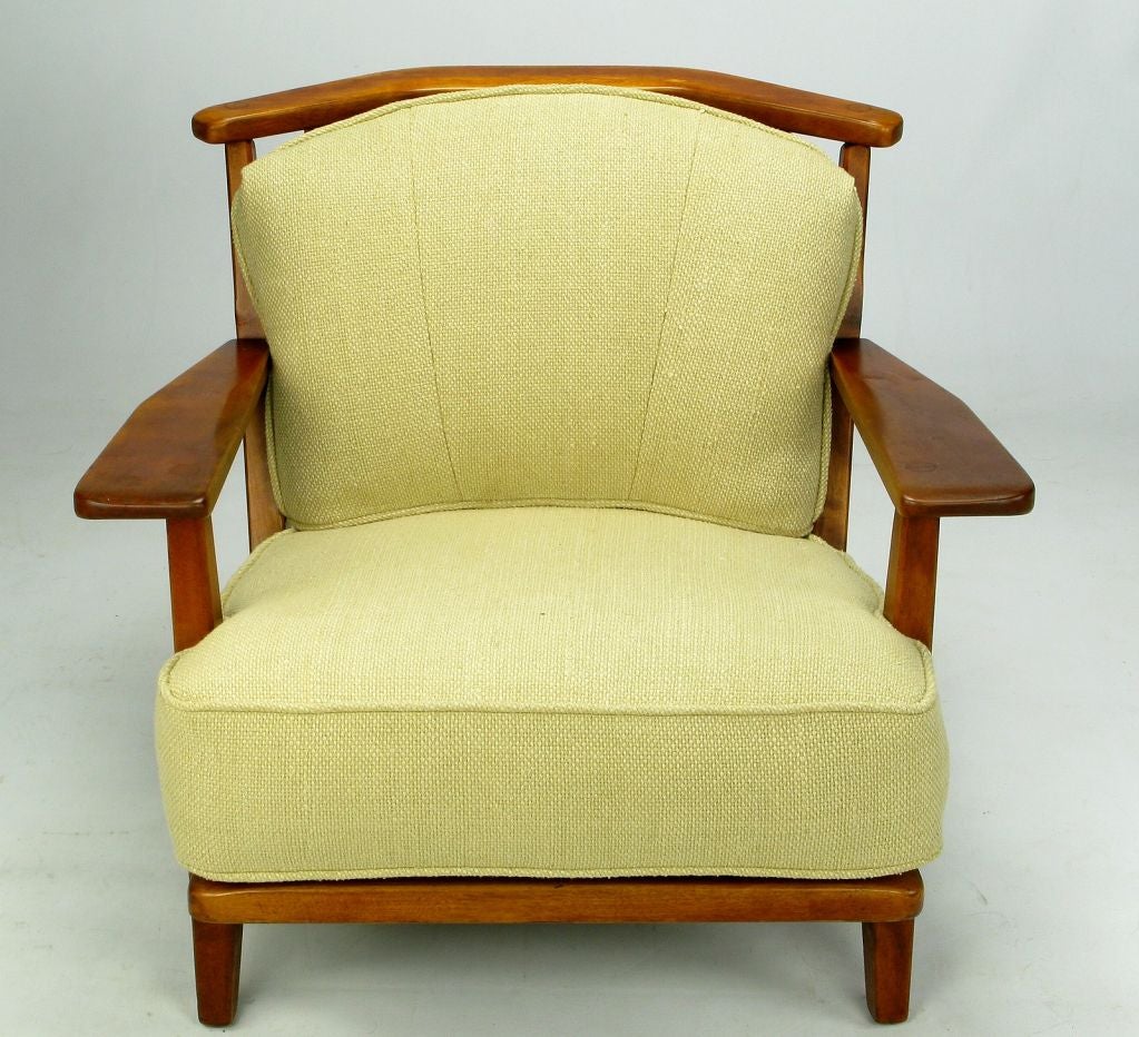 A wonderfully comfortable colonial revival club chair from custom furniture maker Cushman Colonial of Vermont. The birch wood Adirondack-style frame is stained in a warm mahogany and the two cushions are clad in a new mesh backed loose weave cotton