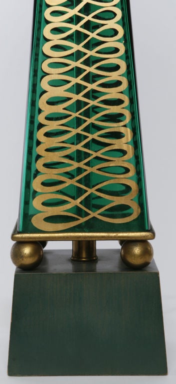 Beautiful design with glass bodies and lacquered wood bases connected by brass spheres on each corner. Emerald green glass bodies have gilt arabesque design on two sides. With new square shades.