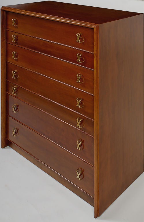 Tall eight-drawer chest in birch, designed by Paul Frankl for Johnson.  Has a mix of deep and shallow drawers, with brass X-form drawer pulls.